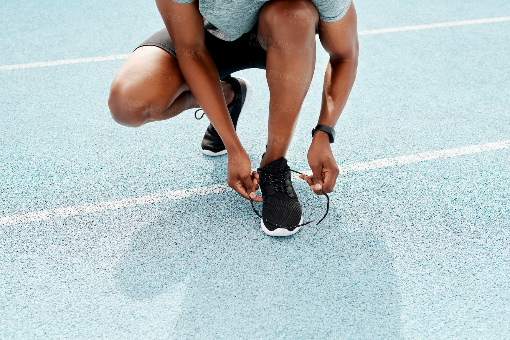 Buy stock photo Running, shoes and hands of fitness man at stadium for training, workout or morning cardio. Shoelace, legs and runner at arena for race track exercise, wellness or resilience, marathon or challenge