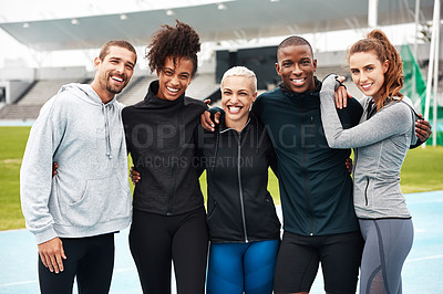 Buy stock photo Cropped portrait of a diverse group of athletes standing together and smiling after an outdoor team training session