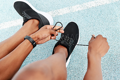 Buy stock photo Fitness, shoes and hands of runner person at stadium for training, workout or morning cardio. Shoelace, pov or athlete at arena for race track exercise, wellness or resilience, marathon or challenge