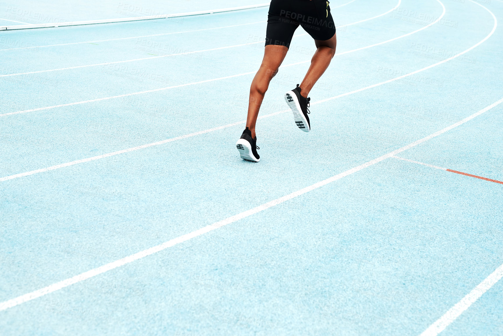 Buy stock photo Man, cropped and stadium for running or sport on track, training or exercise for wellness. Male athlete, arena and runner for freedom or health in sunshine, commitment and fitness with cardio