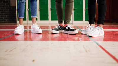 Buy stock photo Low angle shot of a group of unrecognizable student's shoes with them standing and waiting to go to class