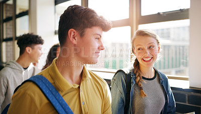 Buy stock photo Cropped shot of a group of cheerful young school kids walking to class together inside of a school during the day