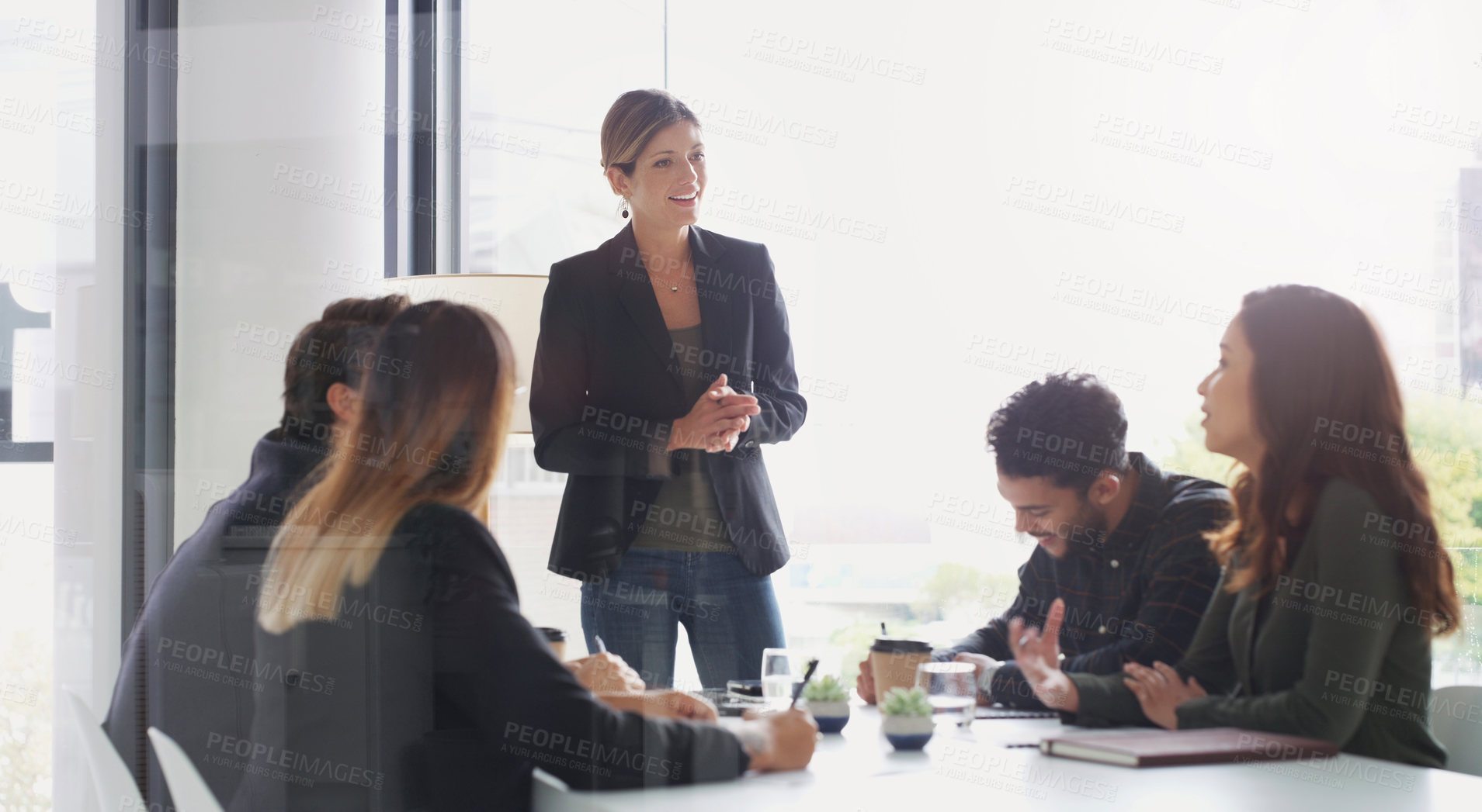 Buy stock photo Shot of a young businesswoman giving a presentation to her colleagues in an office