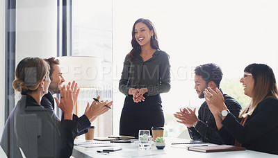 Buy stock photo Shot of a group of businesspeople applauding during a meeting in a boardroom