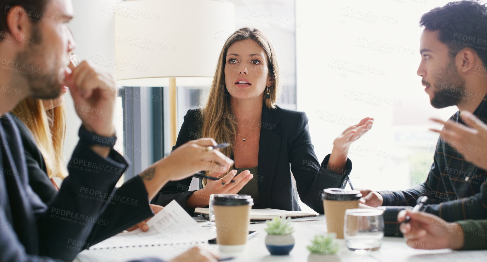 Buy stock photo Shot of a group of businesspeople having a meeting in a boardroom