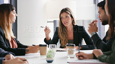 Buy stock photo Shot of a group of businesspeople having a meeting in a boardroom