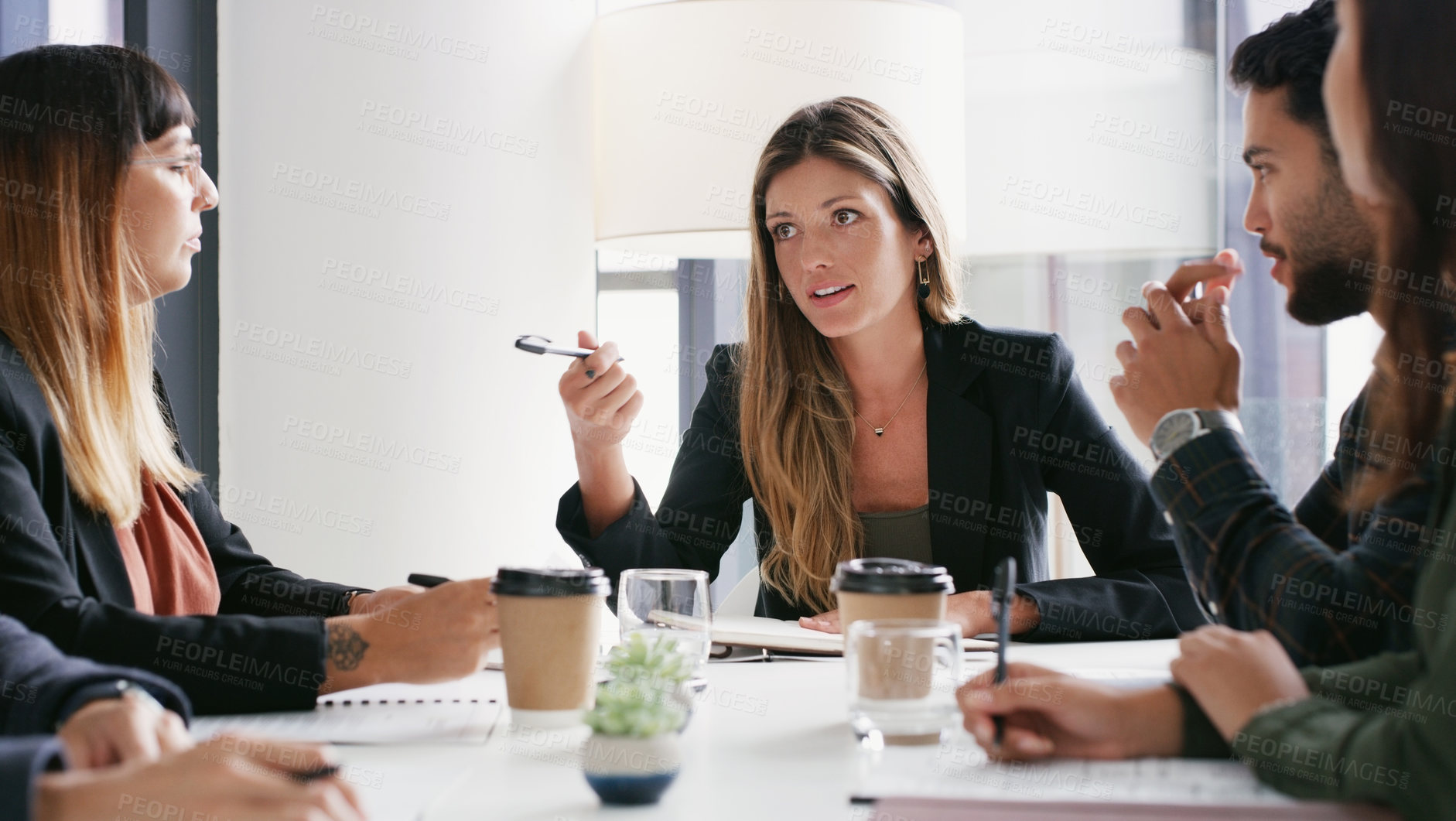 Buy stock photo Shot of a group of businesspeople having a meeting in a boardroom