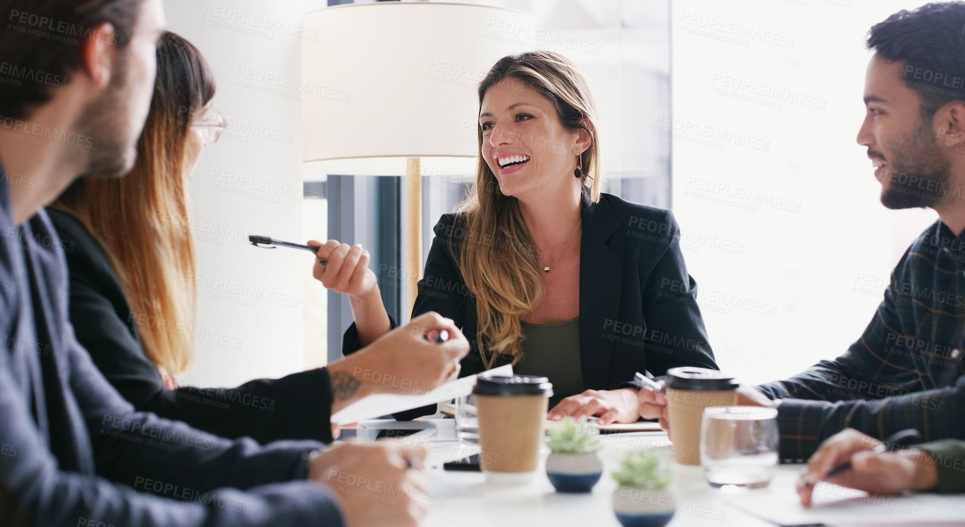 Buy stock photo Shot of a group of businesspeople having a meeting in a boardroom