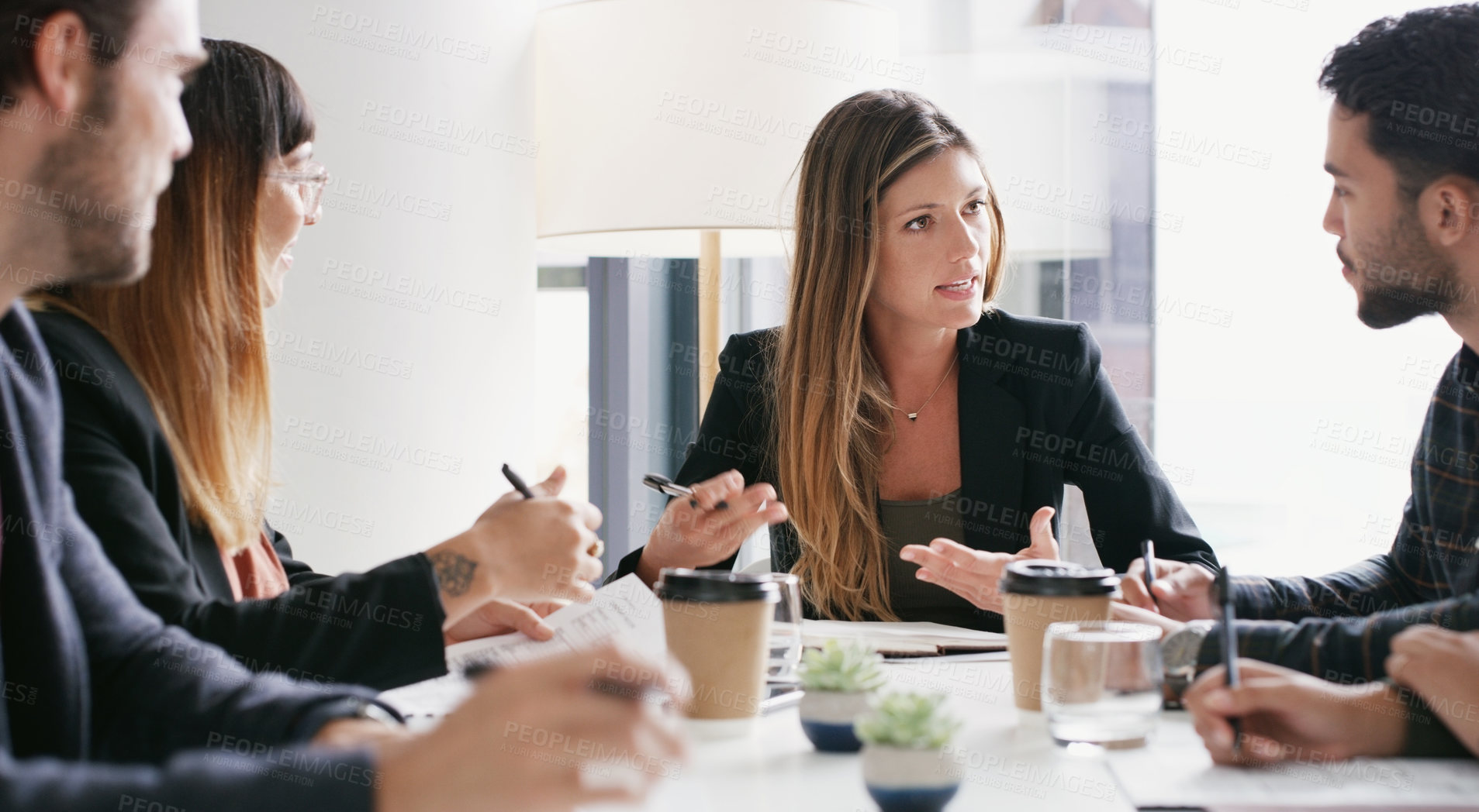 Buy stock photo Shot of a group of businesspeople having a meeting in a boardroom