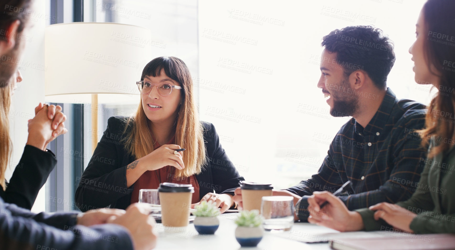 Buy stock photo Shot of a group of businesspeople having a meeting in a boardroom