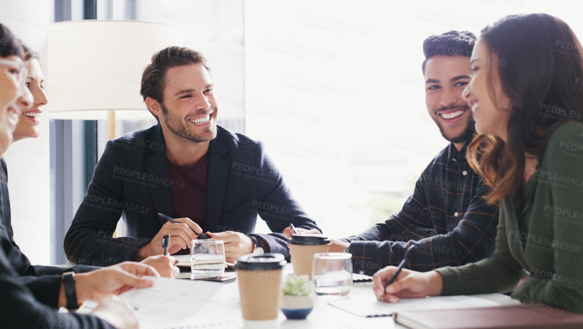 Buy stock photo Shot of a group of businesspeople having a meeting in a boardroom