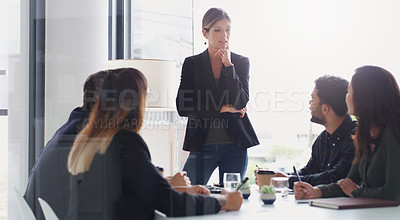 Buy stock photo Shot of a young businesswoman giving a presentation to her colleagues in an office