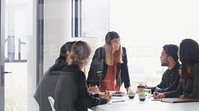 Buy stock photo Shot of a young businesswoman giving a presentation to her colleagues in an office
