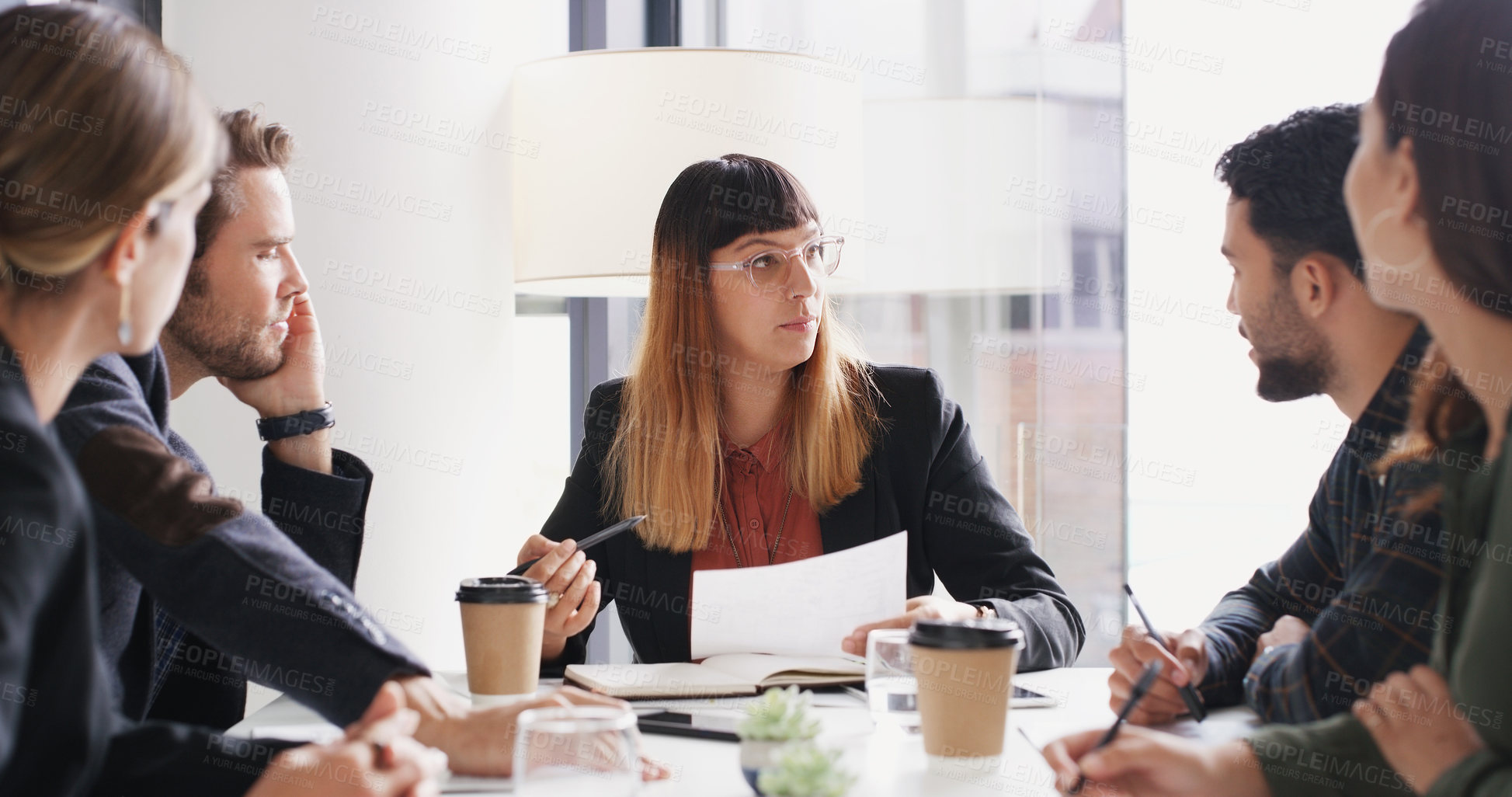 Buy stock photo Shot of a group of businesspeople having a meeting in a boardroom