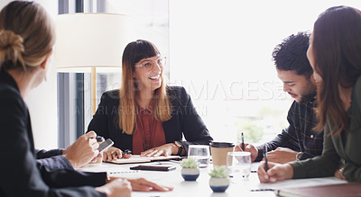 Buy stock photo Shot of a group of businesspeople having a meeting in a boardroom