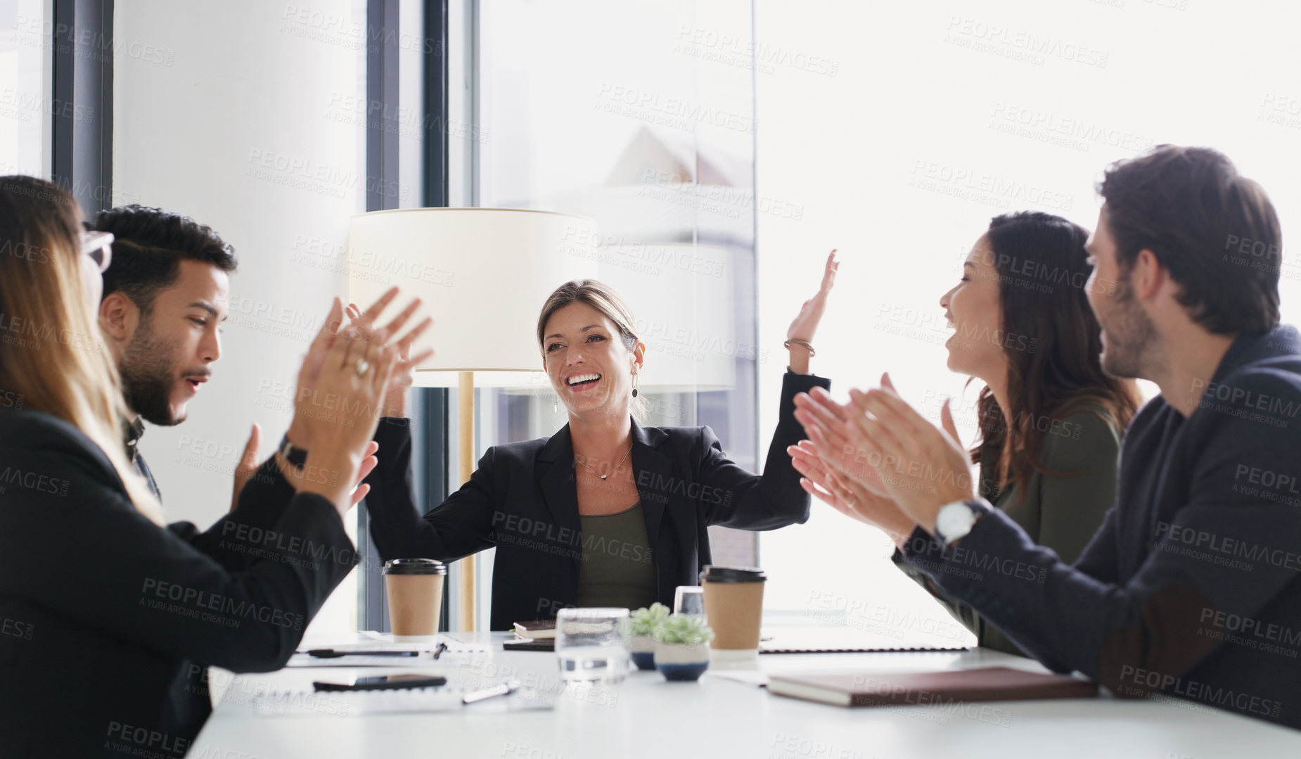 Buy stock photo Shot of a group of businesspeople applauding during a meeting in a boardroom
