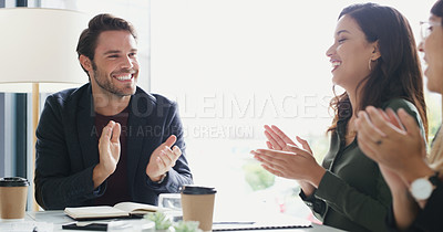 Buy stock photo Shot of a group of businesspeople applauding during a meeting in a boardroom