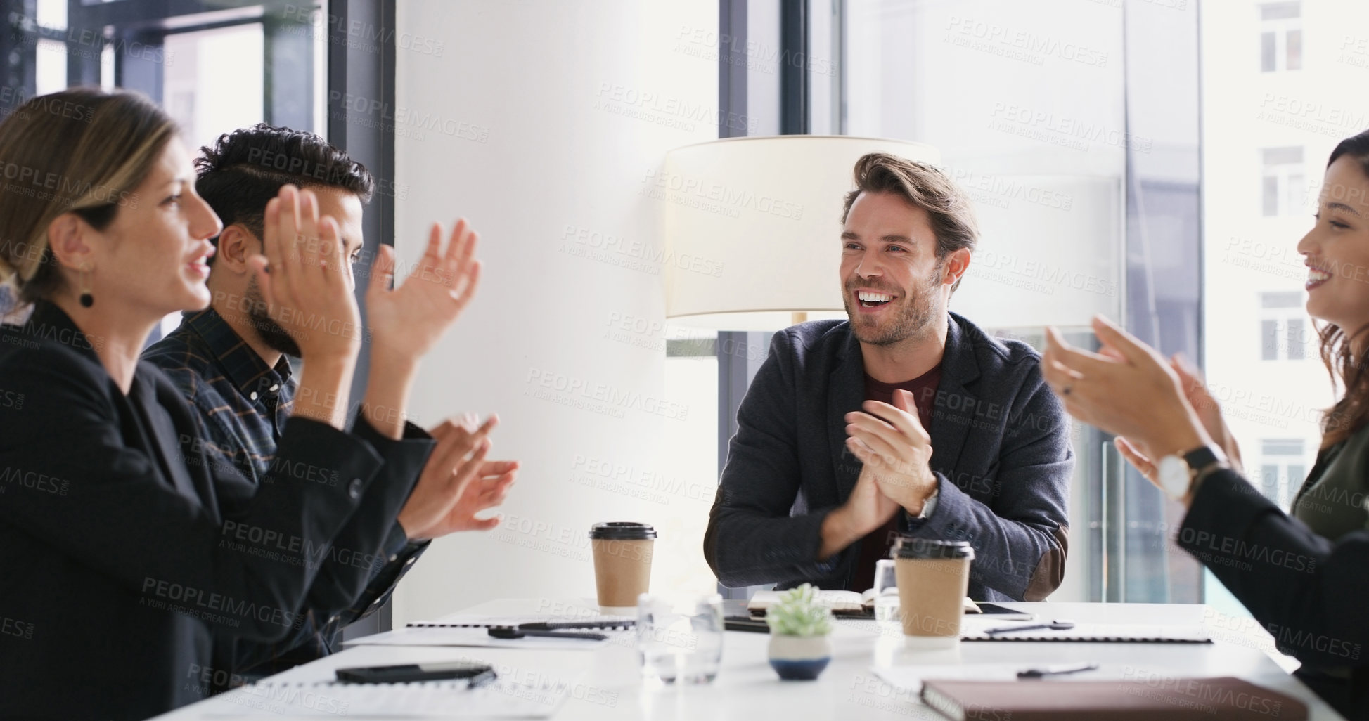 Buy stock photo Shot of a group of businesspeople applauding during a meeting in a boardroom