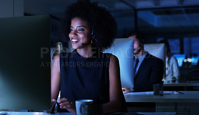 Buy stock photo Cropped shot of an attractive young businesswoman sitting in her office and wearing a headset while working on her computer