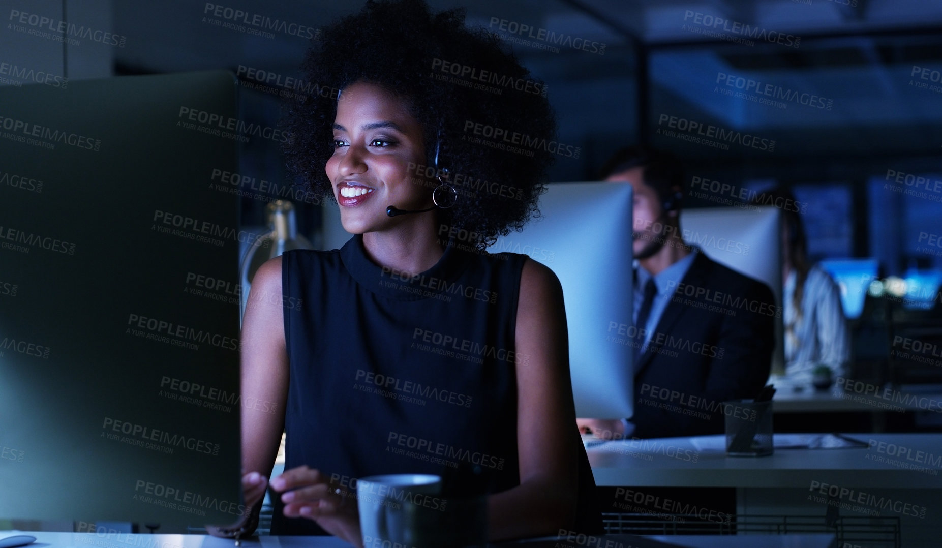 Buy stock photo Cropped shot of an attractive young businesswoman sitting in her office and wearing a headset while working on her computer