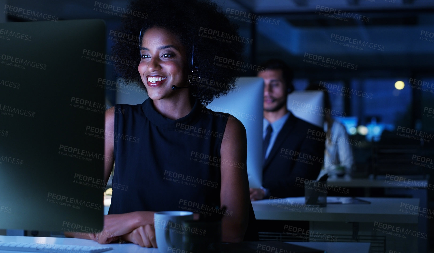 Buy stock photo Cropped shot of an attractive young businesswoman sitting in her office and wearing a headset while working on her computer