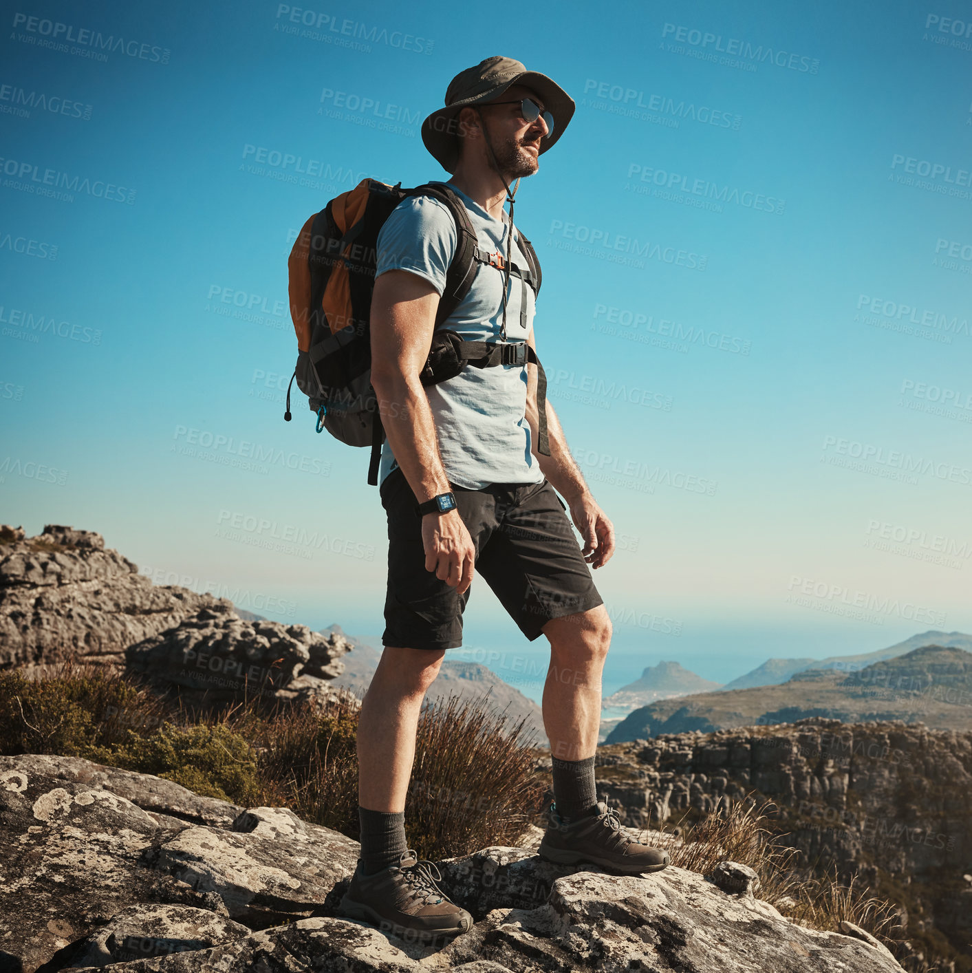 Buy stock photo Shot of a mature man hiking up a mountain