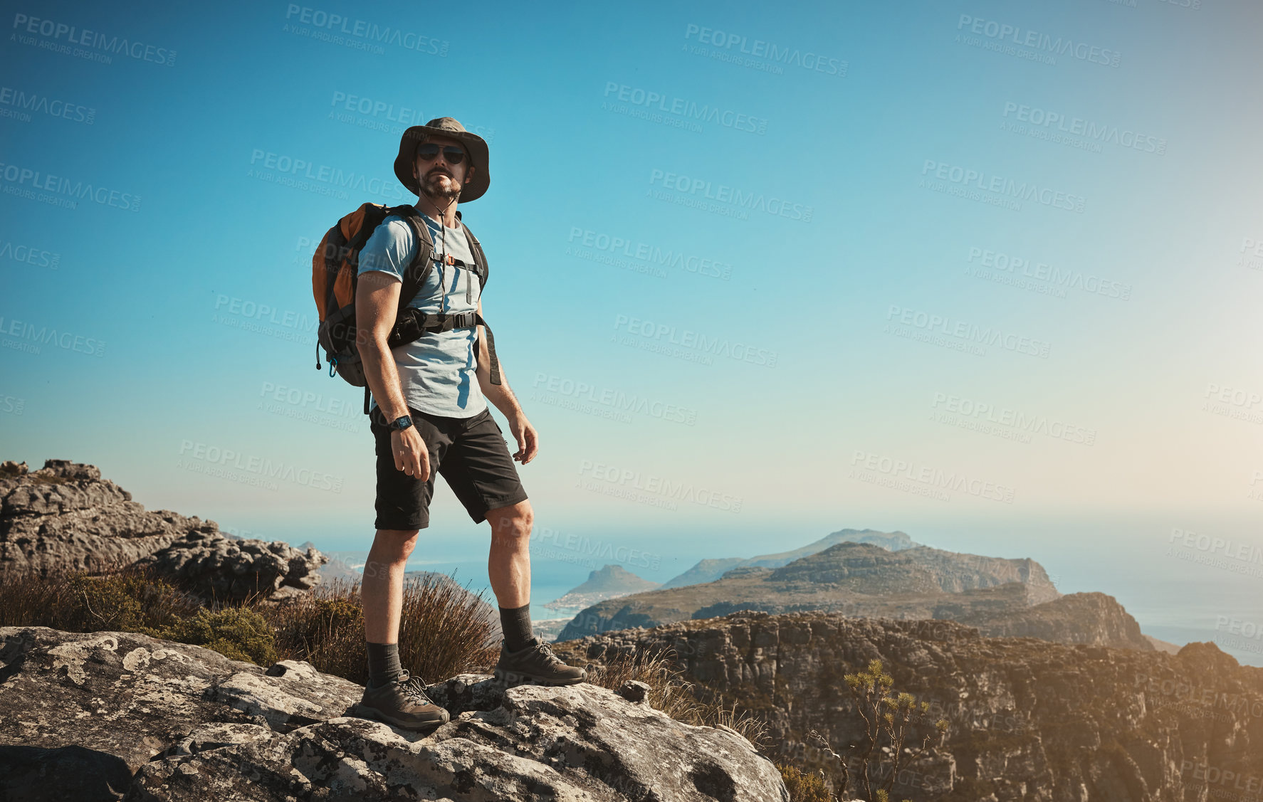 Buy stock photo Shot of a mature man hiking up a mountain