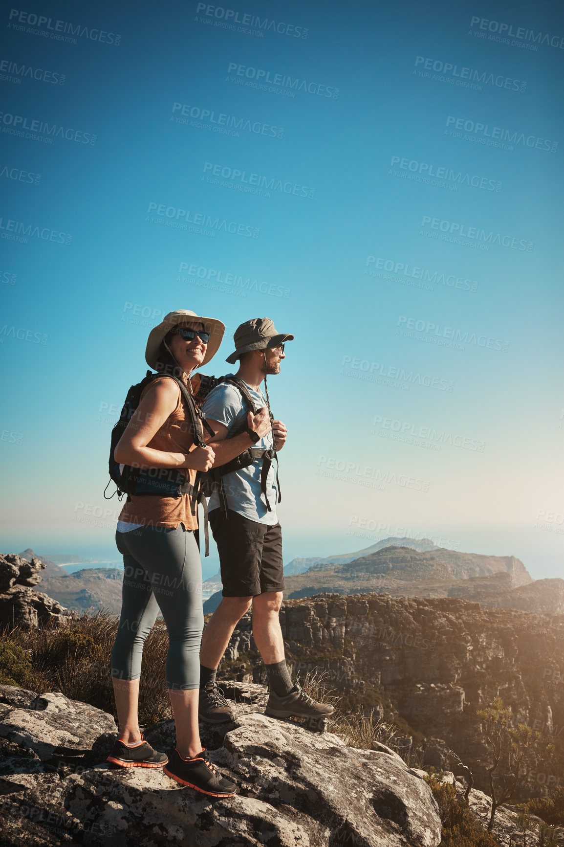 Buy stock photo Hiking, view and happy couple on mountain with fitness for adventure, cliff trekking and backpack. Travel, nature trail and people for wellness and exercise achievement on workout, holiday or journey