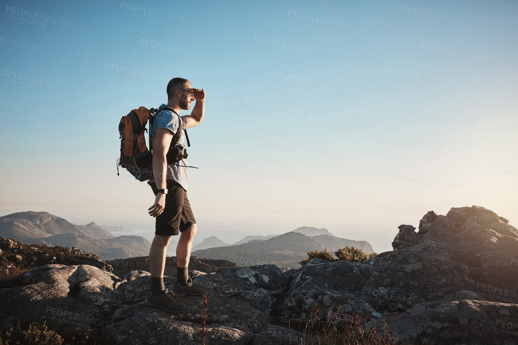 Buy stock photo Shot of a mature man hiking up a mountain