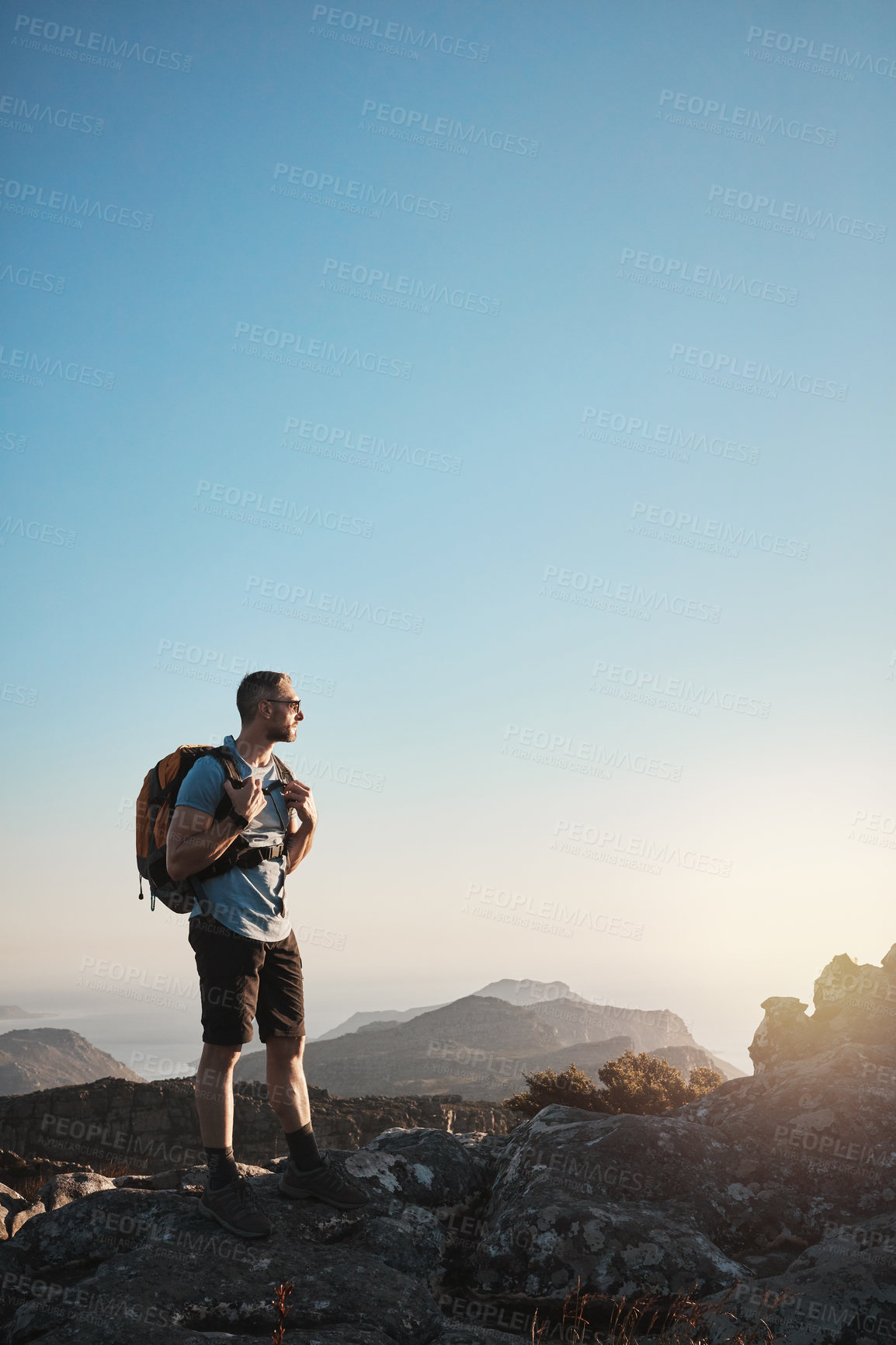 Buy stock photo Man, mountain and hiking on cliff outdoor for fitness travel, adventure view and backpack journey in summer. Hiker, thinking and backpacking for trekking, sky mockup and cardio exercise of wellness