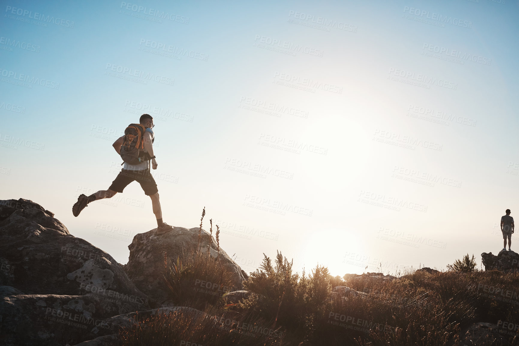 Buy stock photo Shot of a mature man hiking up a mountain