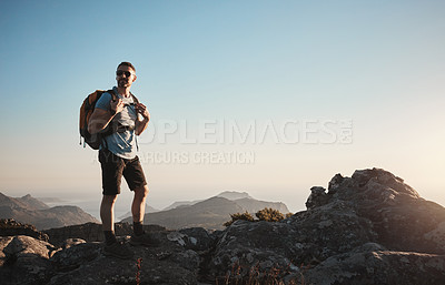 Buy stock photo Shot of a mature man hiking up a mountain