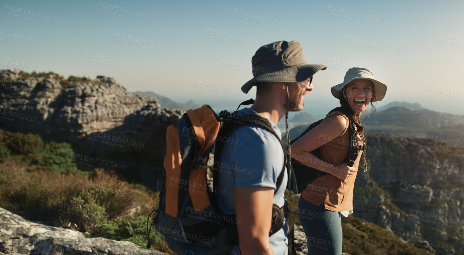 Buy stock photo Shot of a group of friends hiking up a mountain
