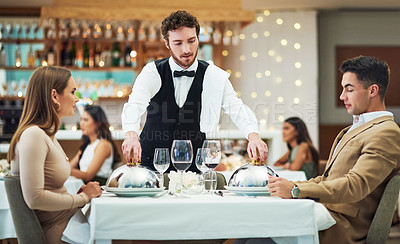 Buy stock photo Restaurant, food and valentines day with a couple at a table in celebration of love, romance or marriage together. Wine, night or luxury fine dining with a man and woman celebrating their anniversary