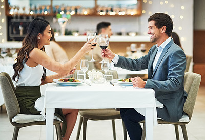 Buy stock photo Love, wine and couple toast in restaurant for romantic dinner, honeymoon and anniversary celebration. Valentines day, fine dining and man and woman together for luxury date, alcohol drinks and relax