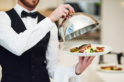 Buy stock photo Waiter, hands and opening plate of food for serving, meal or customer service at indoor restaurant. Man employee caterer or server catering or bringing open dish for fine dining, hospitality or order