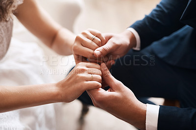 Buy stock photo Couple, bride and groom holding hands for marriage, commitment and wedding ceremony together. Connection, rings and closeup of man and woman with love and romance celebration for partnership.