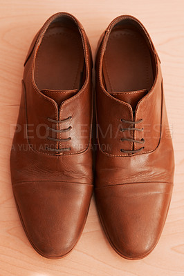 Buy stock photo Shot of two formal men’s shoes on the floor of a bedroom