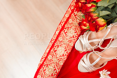 Buy stock photo Ceremony, culture and Indian wedding with shoes, flowers and traditional clothes with celebration. Home, designer high heels and bouquet in bedroom, top view and empty with fashion, gift and stylish