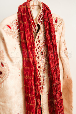 Buy stock photo Shot of men’s clothing in a bedroom before a traditional Indian wedding ceremony