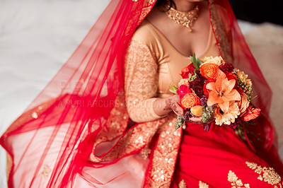 Buy stock photo Cropped shot of an unrecognizable woman holding a bunch of flowers before her wedding