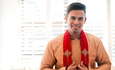Buy stock photo Shot of a handsome young man getting dressed on his wedding day