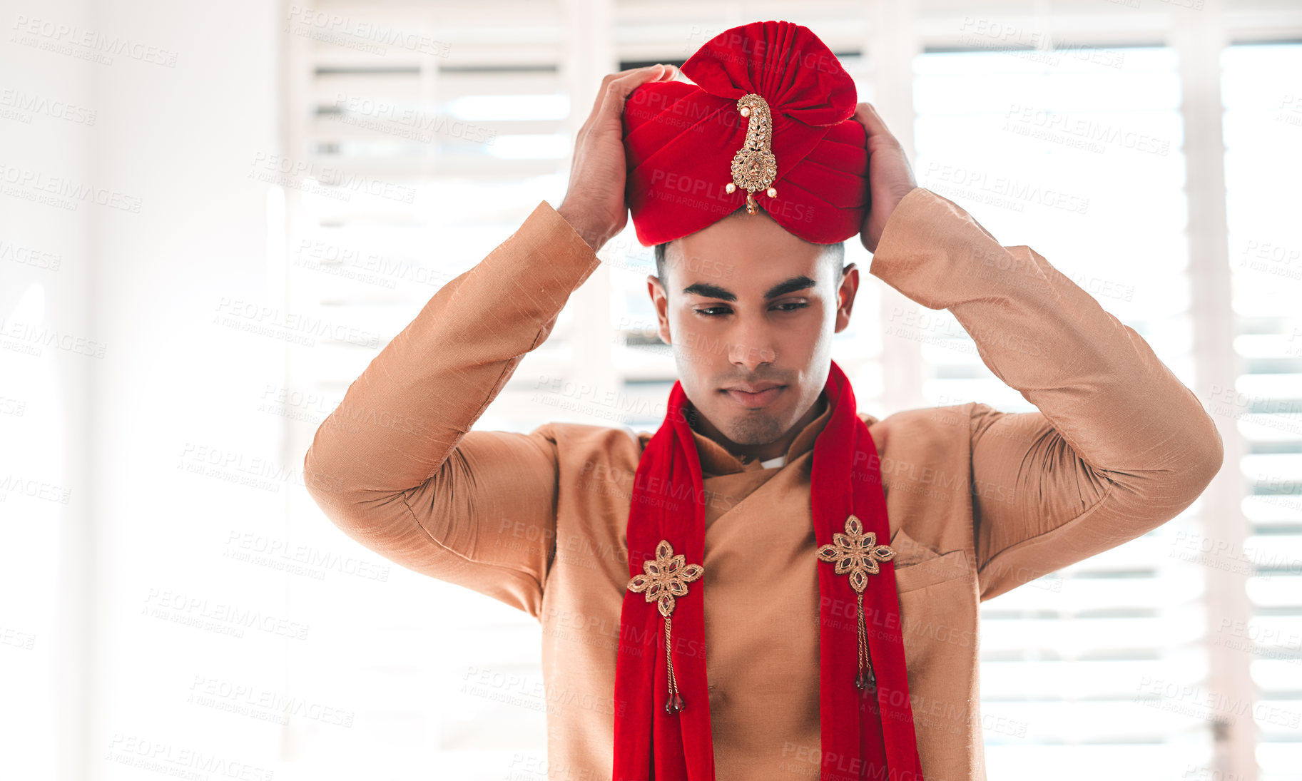 Buy stock photo Shot of a handsome young man getting dressed on his wedding day