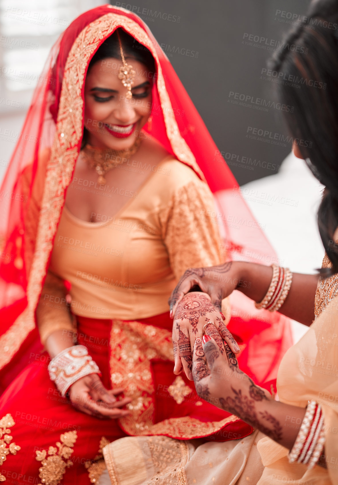Buy stock photo Indian bride, bridesmaid and ring for marriage, celebration and love for wedding. Woman, henna and home culture with traditional mehendi, sari and hindu bridal jewelry with support and help dressing