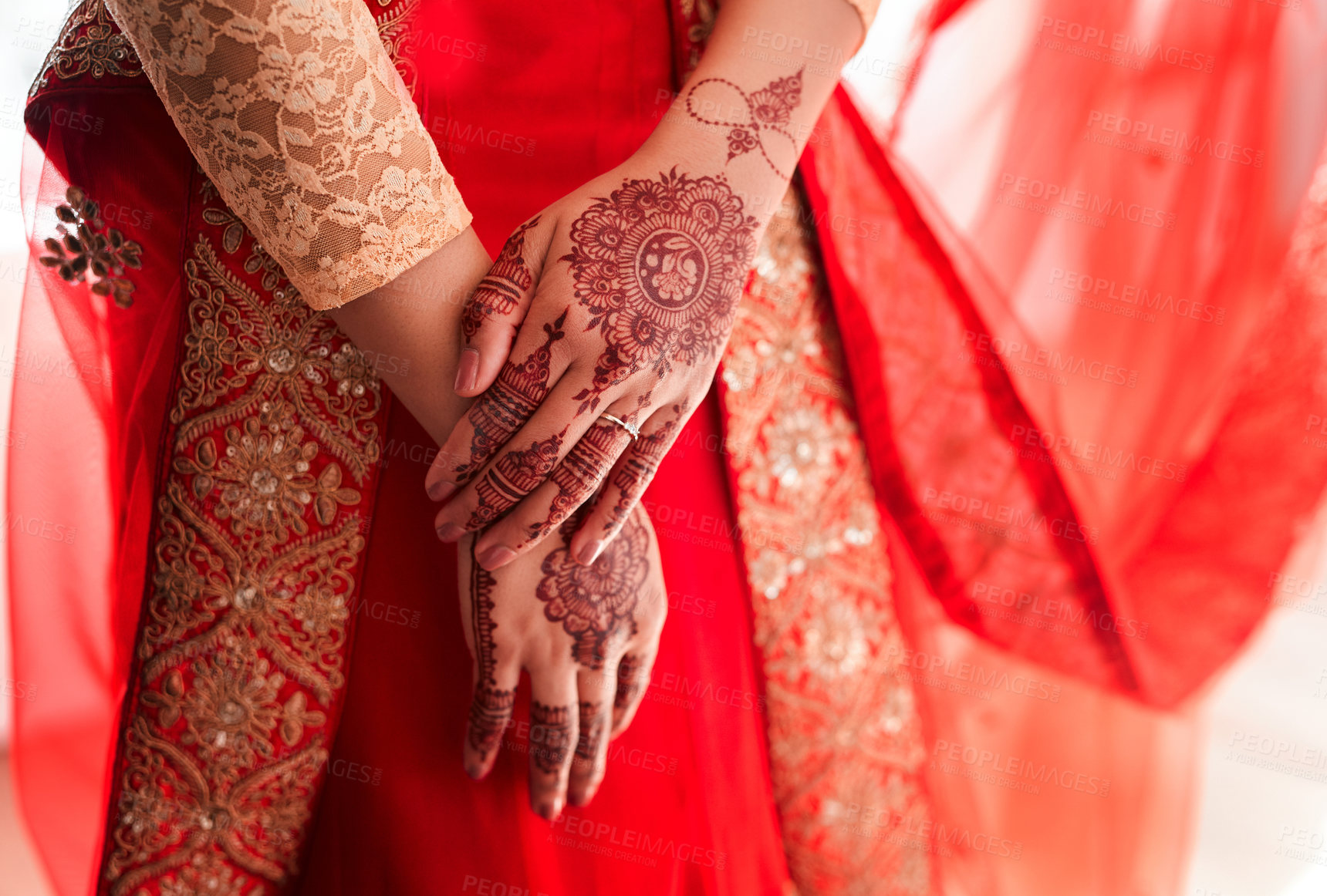 Buy stock photo Cropped shot of an unrecognizable woman with mehendi painted on her hands on her wedding day