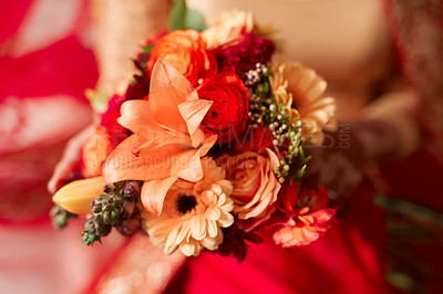 Buy stock photo Cropped shot of an unrecognizable woman holding a bunch of flowers before her wedding