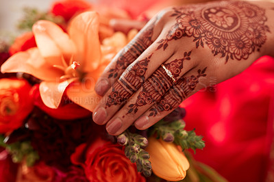 Buy stock photo Henna, hand and Indian bride at her wedding event with flowers or bouquet for decoration or design. Event, marriage and creative female person or woman with art pattern on her hand for celebration