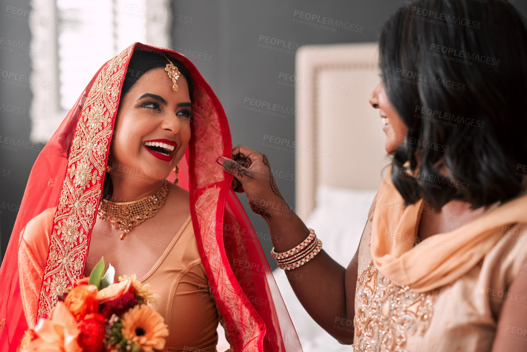 Buy stock photo Happy, bride and bridesmaid getting ready for a wedding, laughing and helping in a room. Support, love and a young woman in traditional Indian clothes for marriage ceremony with a friend or sister