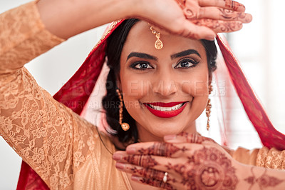 Buy stock photo Portrait of a beautiful young woman covering her face with her hands on her wedding day
