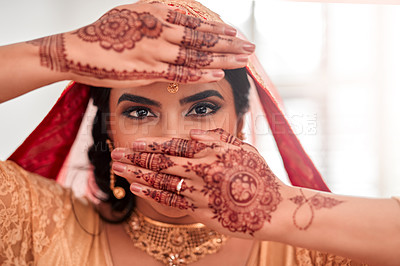 Buy stock photo Portrait of a beautiful young woman covering her face with her hands on her wedding day